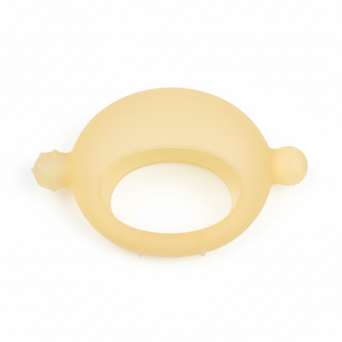 Top-down flat lay of BPA-free lemon crescent silicone infant teether on white background