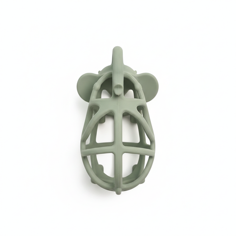 Top-down flat lay of BPA-free sage green hollow elephant silicone baby teether, white background